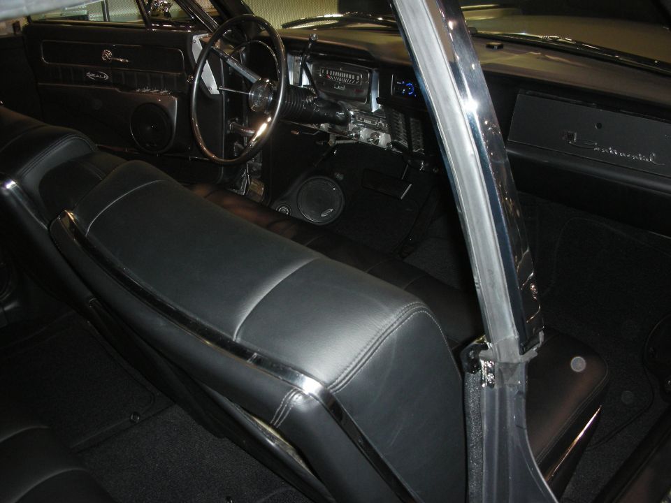 Black leather interior of classic Lincoln Continental with chrome trim