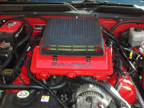 1998 Ford Crown Victoria - black Saleen intake cover sits atop a red-finished engine bay with matching red strut towers and braided lines.