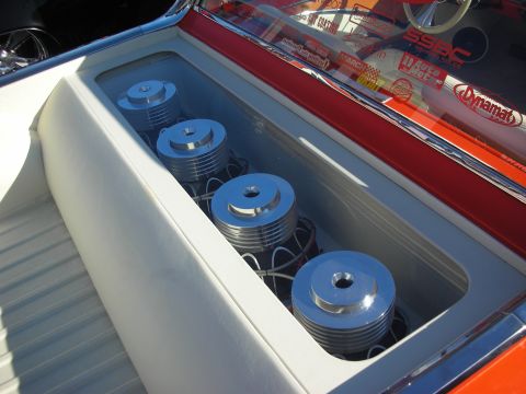1998 Ford Crown Victoria - Four chrome supercharger or pump pulleys mounted in a white-lined engine compartment, with sponsor decals visible above.