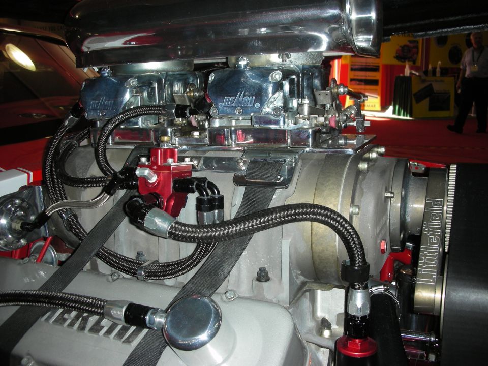 Twin Demon carburetors and braided lines atop a Littlefield blower