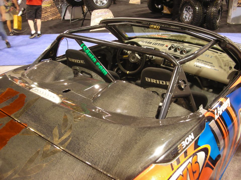 Carbon-fiber and orange convertible drift car interior with Bride seats and roll cage