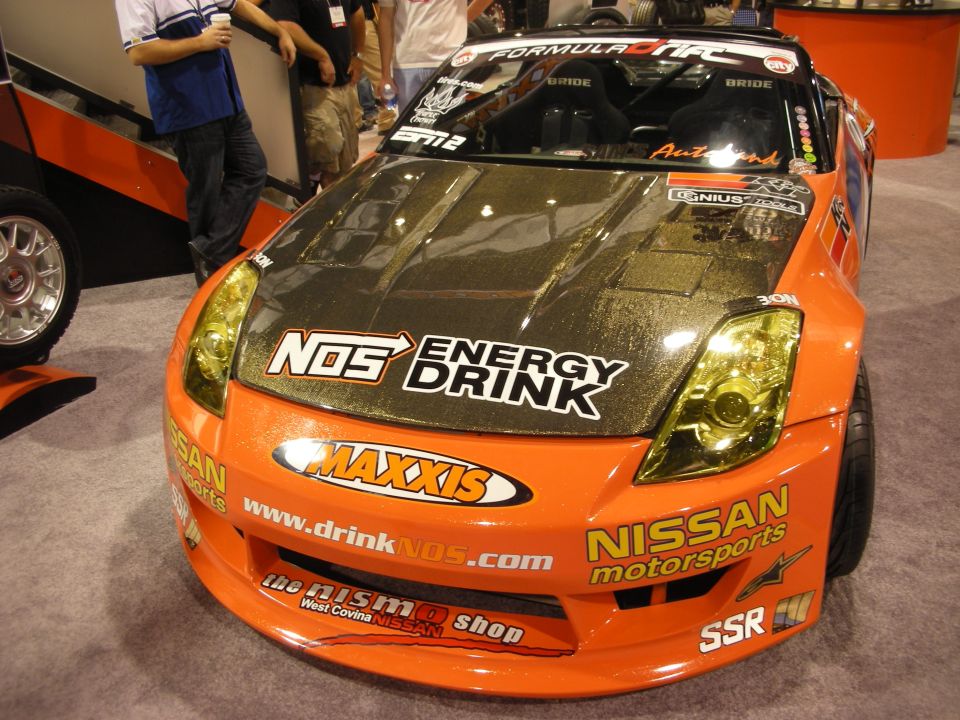 Orange Nissan 350Z drift car with NOS Energy Drink and Maxxis sponsor graphics