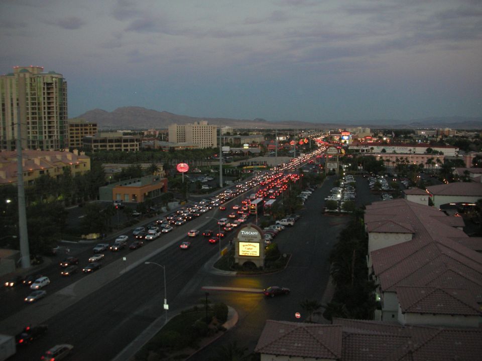Elevated dusk view of a busy multi-lane road in a desert city