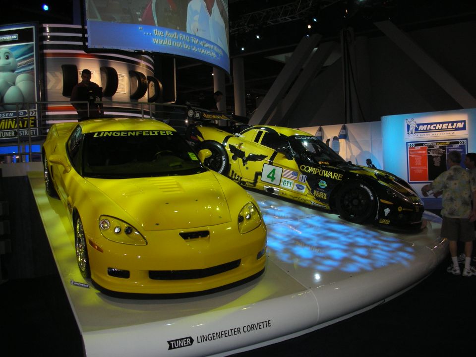 Yellow Lingenfelter Corvette beside a black race Corvette on display