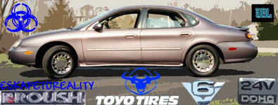 1996 Ford Taurus - Side profile of a 1996 Ford Taurus sedan with various aftermarket decals applied.