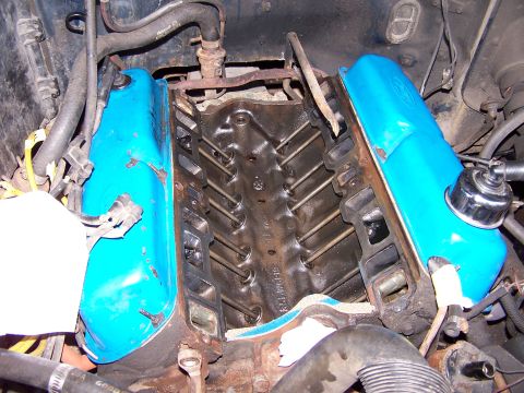1986 Ford Bronco - Close-up view of an engine's internal components, including valve covers and pushrods.