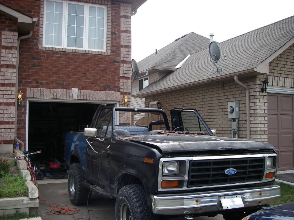 Black convertible SUV with a prominent grille and Ford emblem
