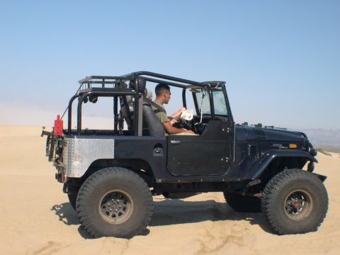 2007 Toyota FJ Cruiser - This vintage off-road vehicle is equipped for desert terrain with its heavy-duty tires and roll cage.