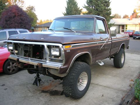 1978 Ford F-250 - Front end of a 1978 Ford F-250 pickup truck is disassembled while on jack stands.