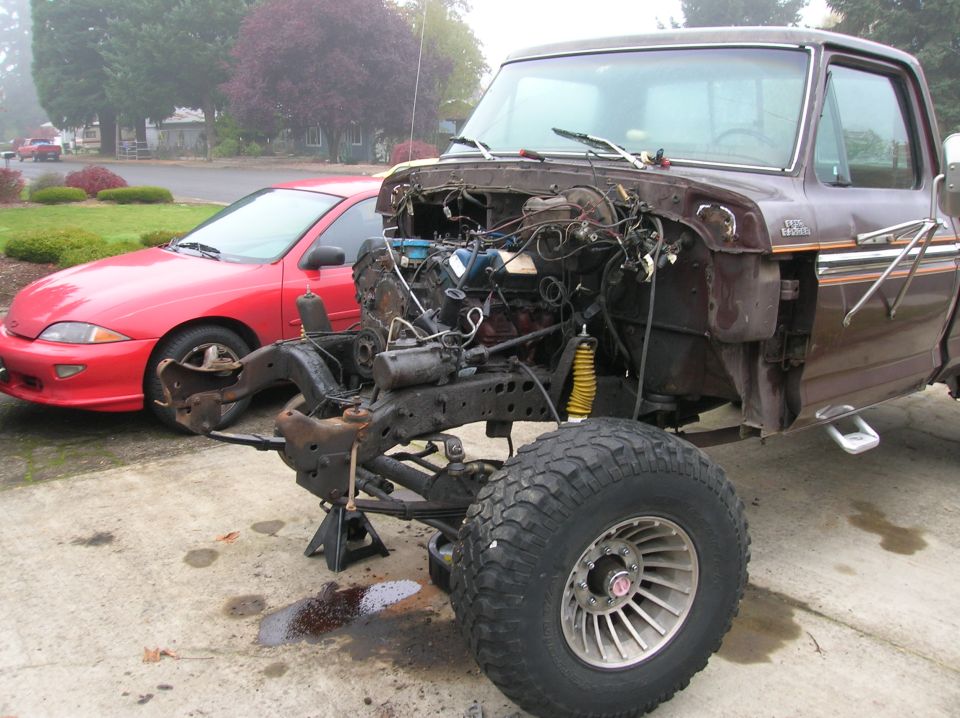 Brown 1978 Ford F-250 pickup truck with engine removed, front view
