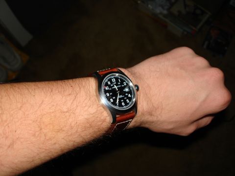 1994 Ford Bronco - Hamilton automatic watch with a brown leather strap is worn on a person's arm.