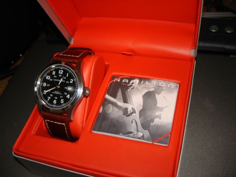 1994 Ford Bronco - A Hamilton watch is presented in its orange display box with a booklet a musical theme.