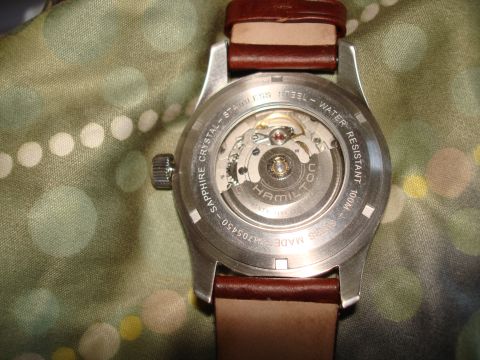 1994 Ford Bronco - Close-up of a watch caseback revealing the intricate automatic movement and brand markings.