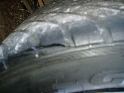 1999 Ford Mustang - This tire has sustained significant damage to its sidewall.