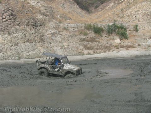 1987 Suzuki Samurai - Suzuki Samurai deep in mud during an off-road excursion.