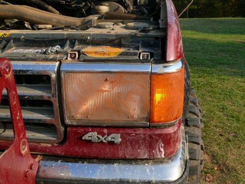 1988 Ford Bronco - Front view of a 1987 Ford F-Series truck, showing the grille and headlight assembly.