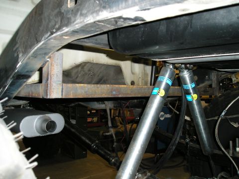 1986 Toyota Hilux - Custom suspension setup on a truck's underbody, dual rear shocks and a new exhaust system.