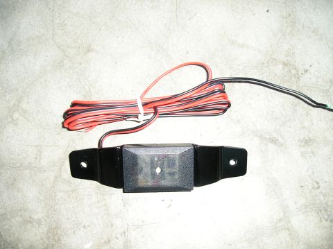 1986 Toyota Hilux - This is a close-up view of an LED rock light module and its associated wiring harness.