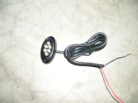 1986 Toyota Hilux - This is an LED rock light with its wiring harness, not a 1986 Toyota Hilux.