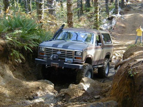 1994 Ford Explorer - Ford Bronco tackles a challenging off-road trail with a winch and snorkel installed.
