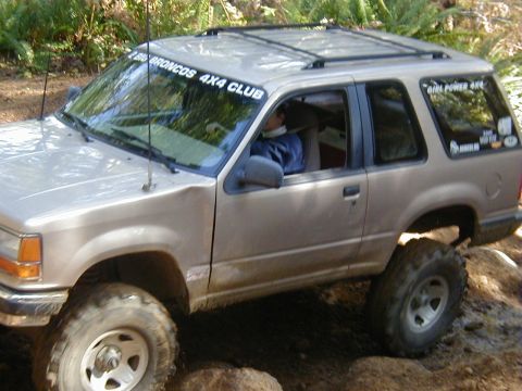 1994 Ford Explorer - This SUV is equipped for off-road adventures, with modifications visible on its suspension and tires.