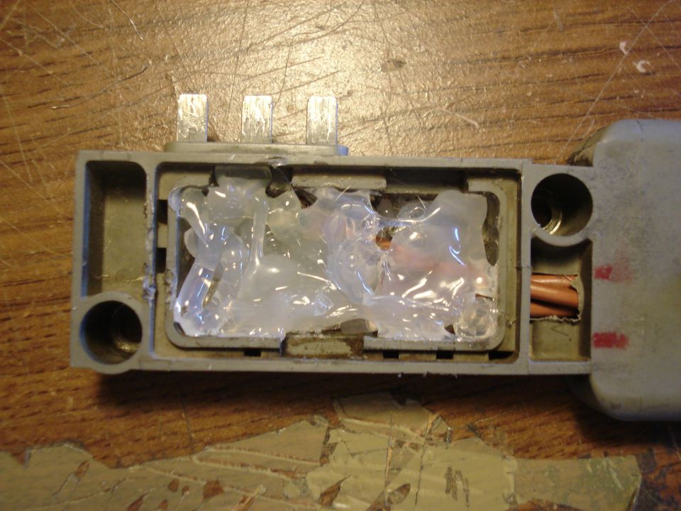 After soldering cables, some hot glue