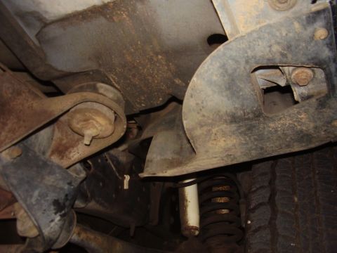 1986 Ford Bronco - Undercarriage view shows suspension components and a tire tread.