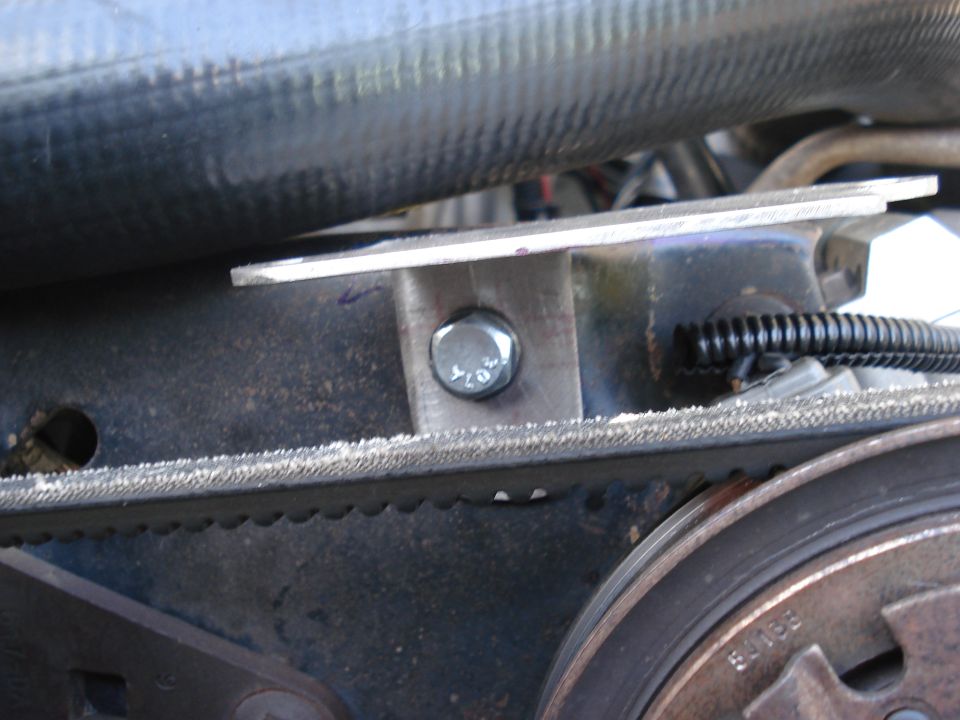 I have some concerns about this location because in case my A/C belt goes the module is very close, so I made the bracket strong enough to resist the shock (2.5 mm stainless steel). All I have to do now is pray so the belt doesn't catch my new harness .........
