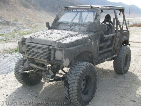 1987 Suzuki Samurai - This heavily modified 1987 Suzuki Samurai is caked in mud after an off-road excursion.