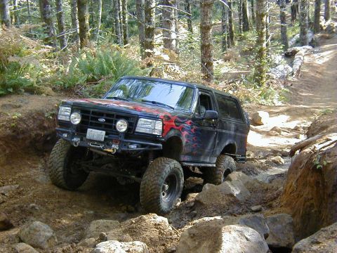 2005 Jeep Wrangler - A modified Ford Bronco navigates a challenging off-road course.