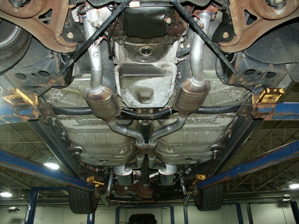 Underbody view of a 2001 Mercury Grand Marquis showing dual exhaust system and catalytic converters