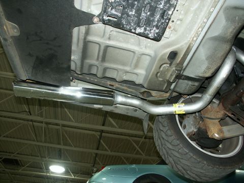 2001 Mercury Grand Marquis - Underside view of a vehicle's exhaust system, a polished chrome tip.
