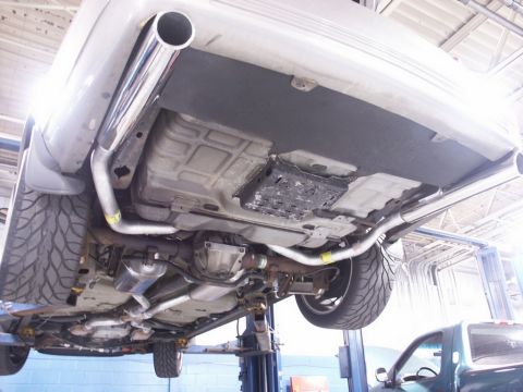 2001 Mercury Grand Marquis - Underneath view of a 2001 Mercury Grand Marquis showing a custom dual exhaust system installation.