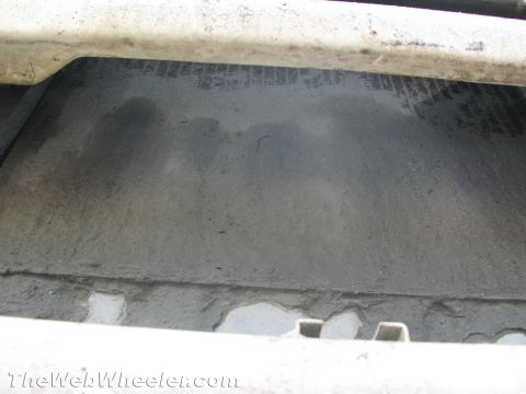 1987 Suzuki Samurai - The radiator of a vehicle is shown up close, with some dirt and grime visible.