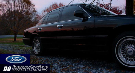 1997 Ford Crown Victoria - Side view of a 1997 Ford Crown Victoria parked outdoors at dusk.