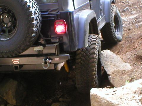 2005 Jeep Wrangler - This 2005 Jeep Wrangler is shown tackling a challenging rock obstacle on an off-road trail.