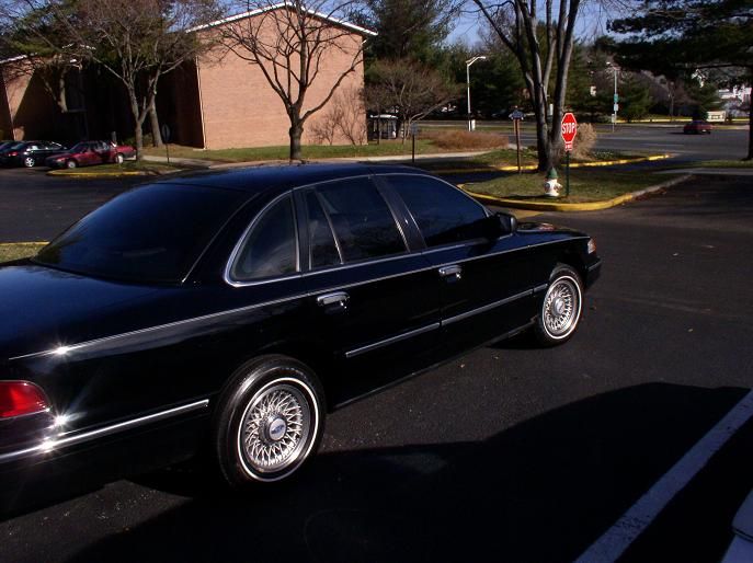 Black 1997 Ford Crown Victoria sedan, 3/4 front view