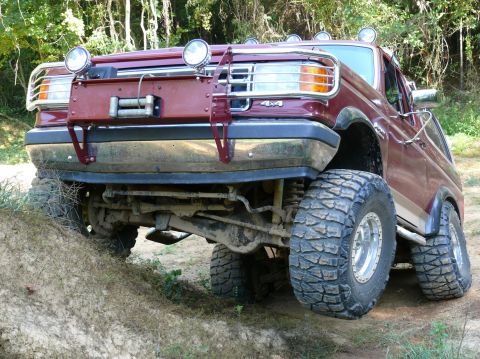 1988 Ford Bronco - This 1988 Ford Bronco is equipped with a winch and large off-road tires, ready for terrain.