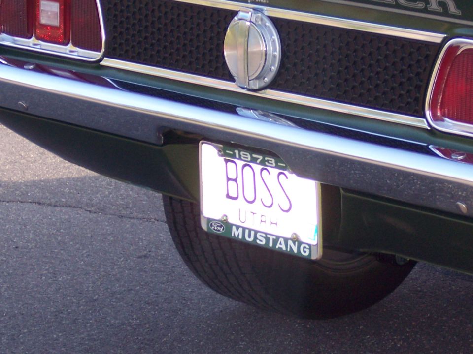 Rear of a 1973 Ford Mustang with a "BOSS" license plate from Utah