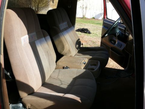 1988 Ford Bronco - Front bucket seats and center console of a 1988 Ford Bronco.