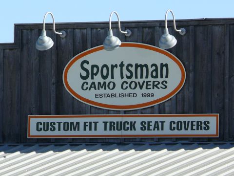 1988 Ford Bronco - Sign for a business selling custom fit truck seat covers, established in 1999.