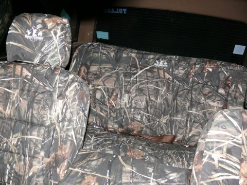 1988 Ford Bronco - Interior view of seats covered in camouflage fabric, the 'Sportsman' logo.