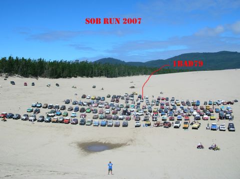 1979 Ford Bronco - A large group of vehicles are parked on a sandy landscape, with overlaid text indicating 'SOB RUN 2007' and '1BAD79'.