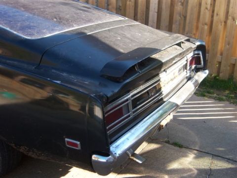 1971 Mercury Cyclone - Rear view of a black 1971 Mercury Cyclone, showing its spoiler and taillight design.