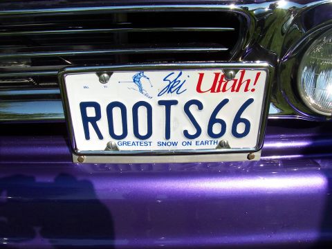 1973 Ford Mustang - The license plate reads "ROOTS66" and features the slogan "Greatest Snow on Earth" with a skier graphic.