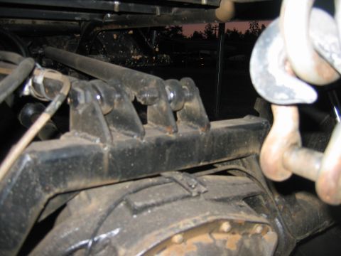 1992 Ford Mustang - Detail shot of a vehicle's rear axle and suspension system, heavy-duty tow hooks.