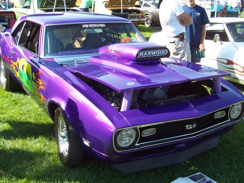 1973 Ford Mustang - Customized 1969 Chevrolet Camaro drag car with a large hood scoop and flame graphics.