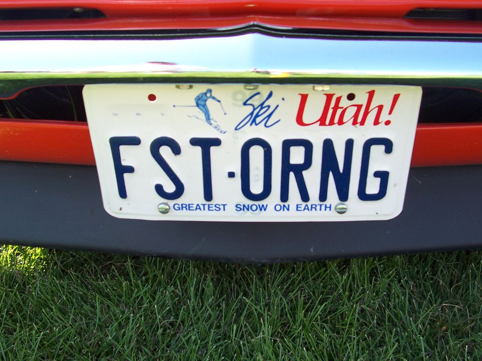 Utah license plate reading FST-ORNG with a skier graphic and 'Greatest Snow on Earth' text
