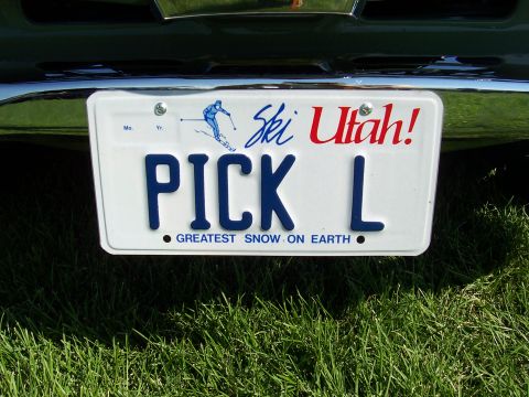 1973 Ford Mustang - A Utah license plate with the slogan 'Greatest Snow on Earth' is attached to a vehicle.
