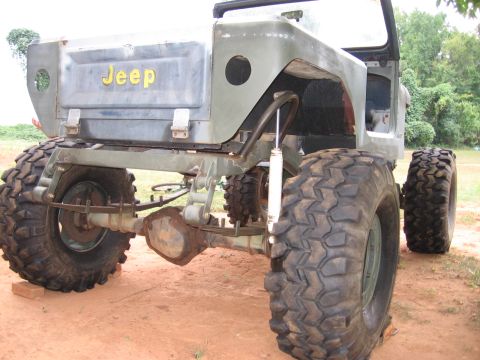 1980 Jeep CJ7 - This modified Jeep has oversized tires and a utilitarian olive drab paint scheme.